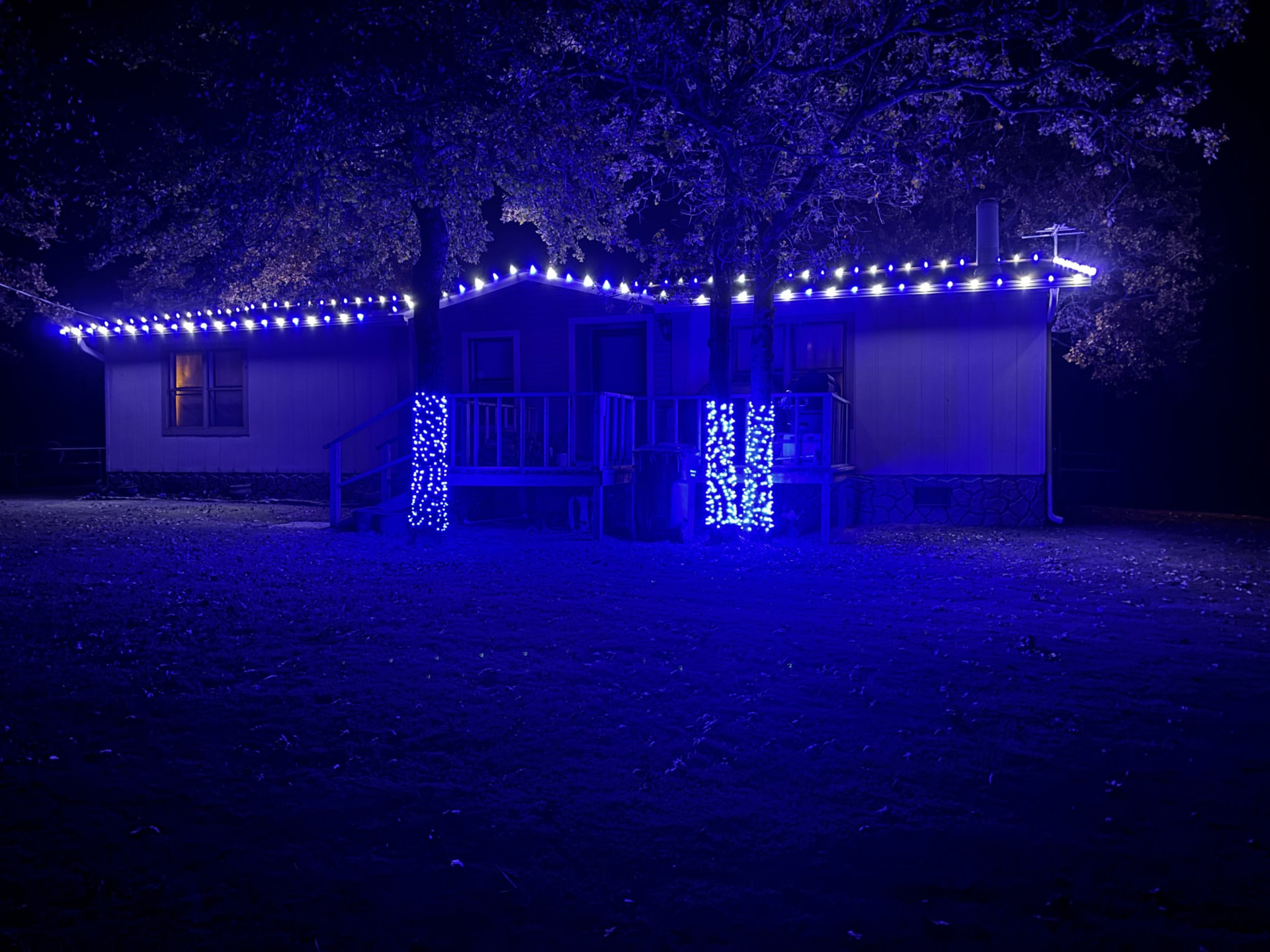 Blue roofline Christmas lights installed on a home