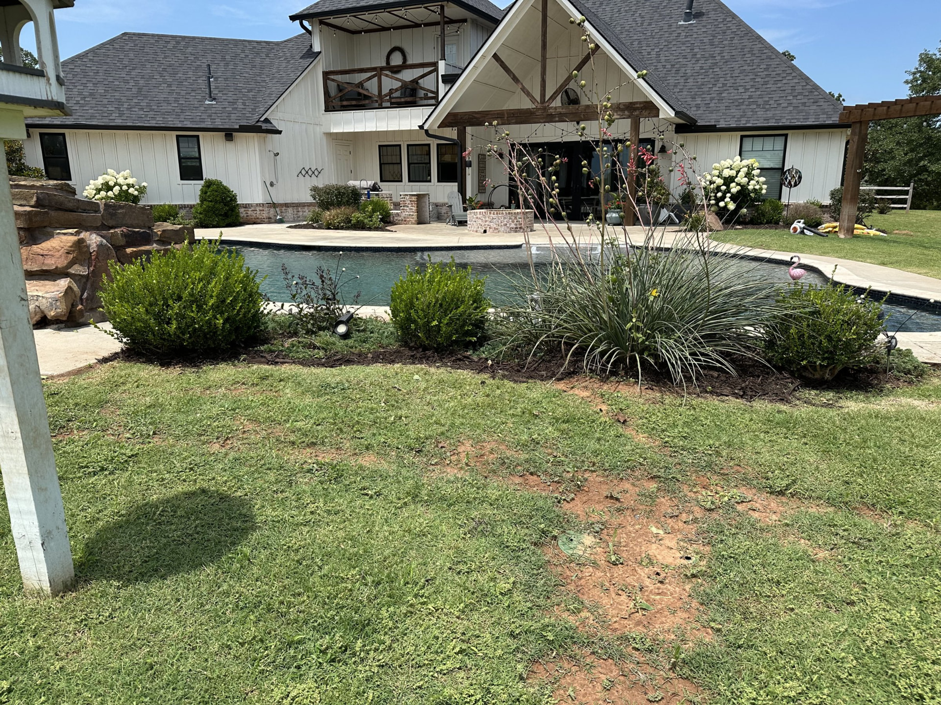 Pool backyard with landscaped beds in the OKC metro