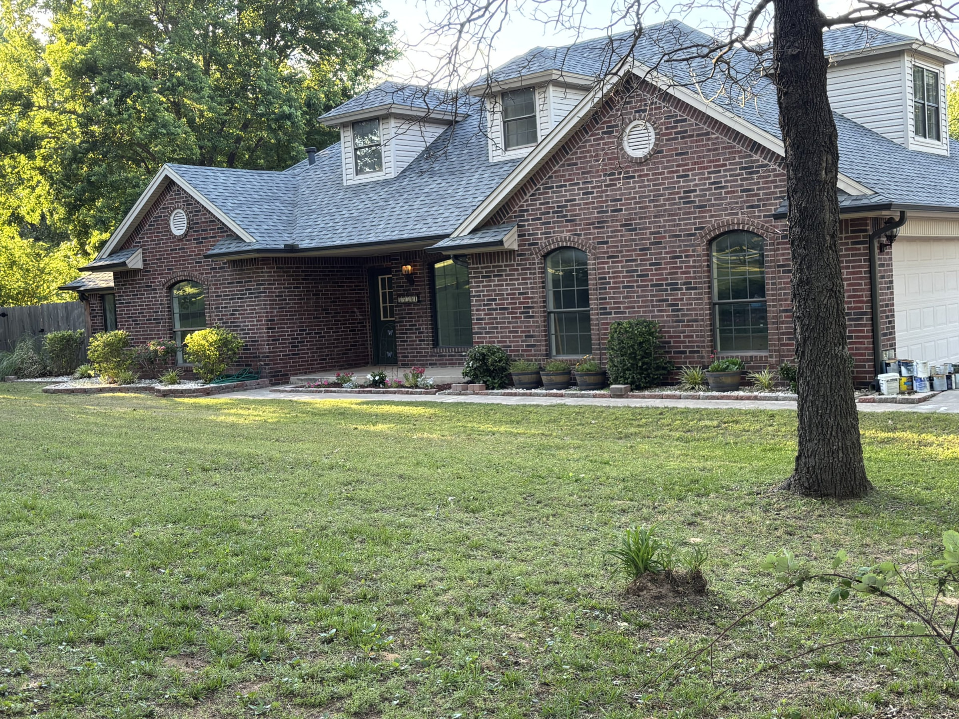 Brick home with a clean mowed lawn in the OKC metro