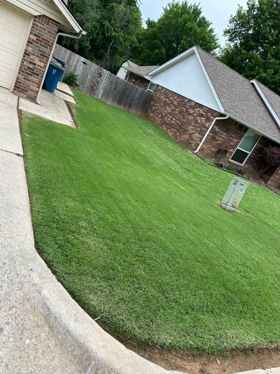Neatly mowed side yard in the OKC metro